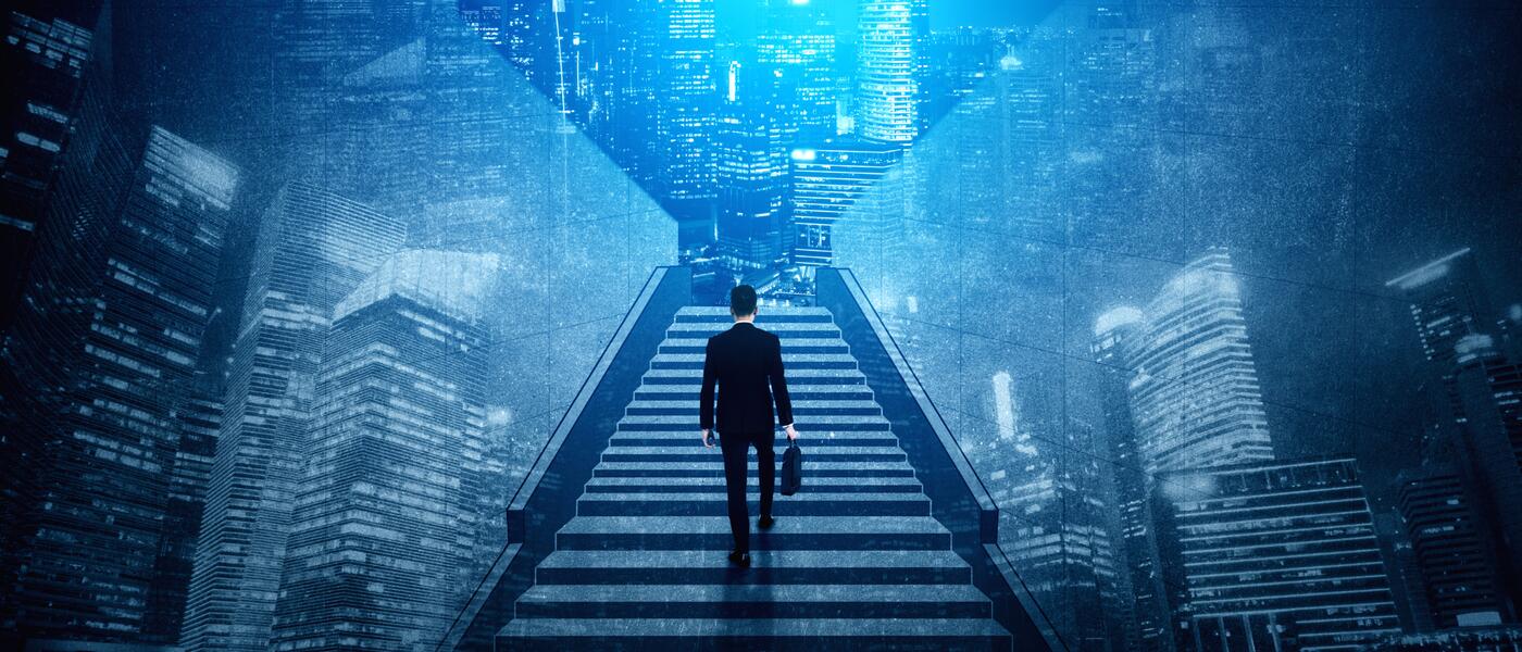 Legal operations leader planning department strategy on stairway overlooking city