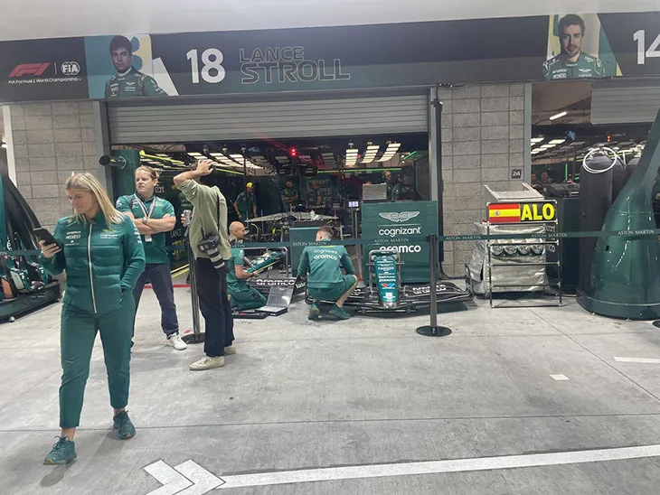 Hassan el Asraoui with the pit crew at formula 1 grand prix